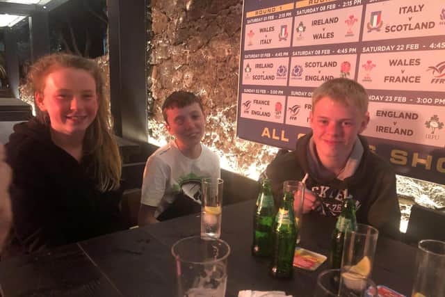 Nicola's son Tyler (centre) with Hannah and James Evans are stuck in Lanzarote after all  flights were grounded due to a huge sandstorm.