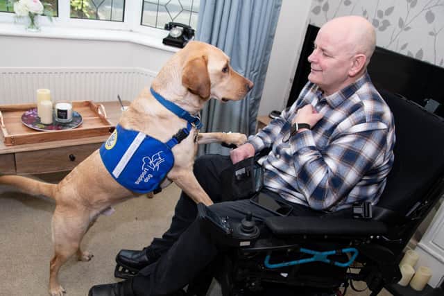 John Newcombe with Casper, his award winning support dog