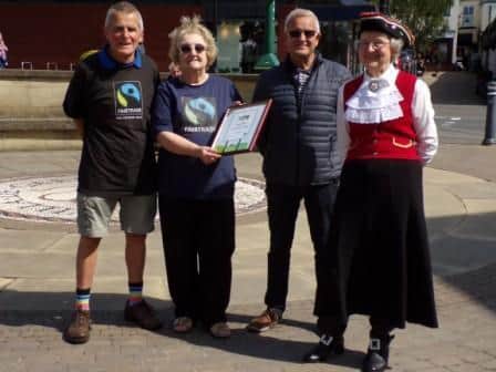 Pictured (from left) Philip Riley, Ruth Bruce, Peter Ryder and Town Crier Hilary McGrath celebrating the latest renewal of Garstang's Fairtrade Town status.