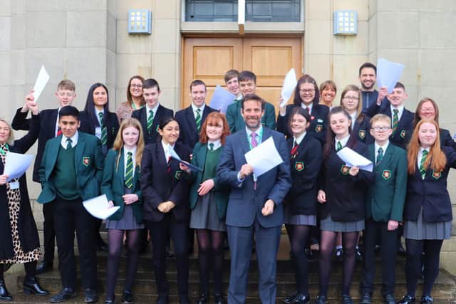 All smiles ...Mr Stephen Cox and his staff and pupils are thrilled with their most recent Ofsted inspection report