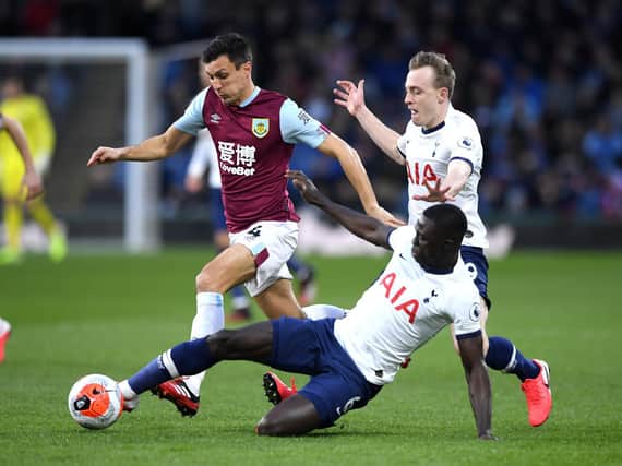 Jack Cork of Burnley is tackled by Davinson Sanchez of Tottenham Hotspur during the Premier League match at Turf Moor on March 07, 2020. (Photo by Stu Forster/Getty Images)