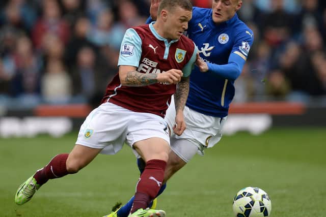 Kieran Trippier battles for the ball with Leicester City striker Jamie Vardy