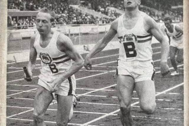 GB athletes  Barry Jackson hands over to Malcolm Yardley in the 4x400m