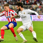 Atletico Madrid's English defender Kieran Trippier (L) is marked by Real Madrid's Spanish midfielder Isco during the Spanish Super Cup final between Real Madrid and Atletico Madrid on January 12, 2020, at the King Abdullah Sports City in the Saudi Arabian port city of Jeddah. (Photo by Giuseppe CACACE / AFP) (Photo by GIUSEPPE CACACE/AFP via Getty Images)