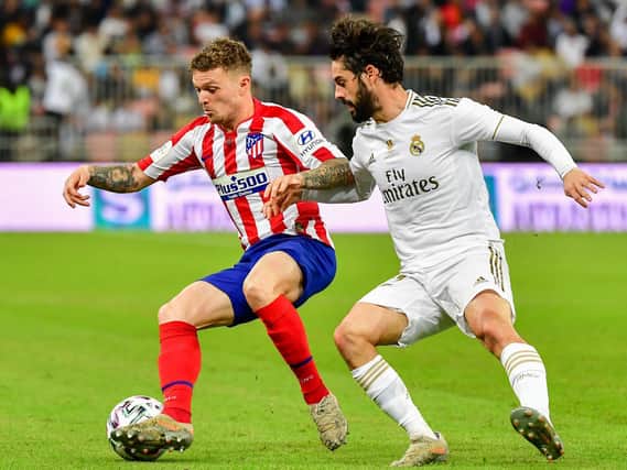 Atletico Madrid's English defender Kieran Trippier (L) is marked by Real Madrid's Spanish midfielder Isco during the Spanish Super Cup final between Real Madrid and Atletico Madrid on January 12, 2020, at the King Abdullah Sports City in the Saudi Arabian port city of Jeddah. (Photo by Giuseppe CACACE / AFP) (Photo by GIUSEPPE CACACE/AFP via Getty Images)