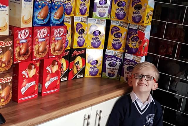 Proud George with some of the Easter eggs that have been donated already.