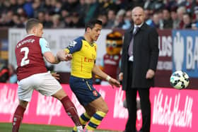 Kieran Trippier vies with Chilean striker Alexis Sanchez during the English Premier League football match between Burnley and Arsenal at Turf Moor on April 11, 2015. AFP PHOTO / LINDSEY PARNABY