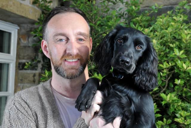 Michael Huckerby, owner of The Lawrence Hotel in Padiham, with his dog Hetty. He has set up a 'pop up' shop at the hotel for the elderly and vulnerable in the community.