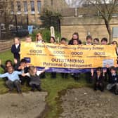 Pupils at Lord Street Community Primary School in Colne celebrate their latest OFSTED report.