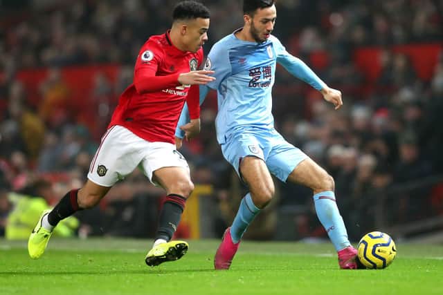 Dwight McNeil of Burnley battles for possession with Mason Greenwood of Manchester United during the Premier League match between Manchester United and Burnley FC at Old Trafford on January 22, 2020 in Manchester, United Kingdom. (Photo by Alex Livesey/Getty Images)