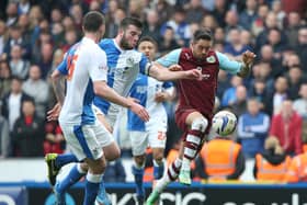 Danny Ings of Burnley battles with Grant Hanley of Blackburn Rovers during the Sky Bet Championship match between Blackburn Rovers and Burnley at Ewood Park on March 9, 2014 in Blackburn, England. (Photo by Jan Kruger/Getty Images)