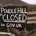The sign says it all and police have pleaded with walkers to stay away from Pendle Hill until the pandemic is over.