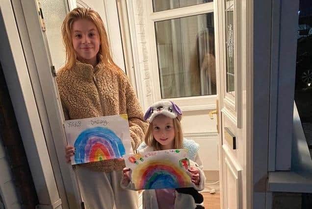 Cambridge Drive, Padiham, young residents Jolie Forrest (11) and her little sister Trixie (four) share their rainbow pictures to show solidarity for communities before they took part in the 'Clap for Carers' tribute last night.