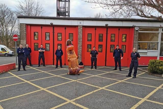 Padiham firefighters welcome the friendly T Rex when he paid the station a visit last night.