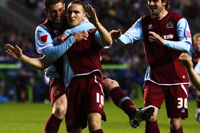 Martin Paterson celebrates with strike partner Steven Thompson and midfielder Chris McCann after putting Burnley 2-0 up on aggregate against Reading in the Championship play-off semi-final in 2009
