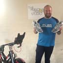 CLANs Michael Brennand with new shoes he had bought himself to
run for Rosemere Cancer Foundation in the London Marathon, which should
have been taking place this month but is postponed so which he is now going
to use to take part in the charitys first ever virtual marathon!
