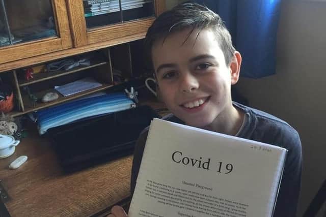 Levi Sher with the piece he wrote on Covid 19.