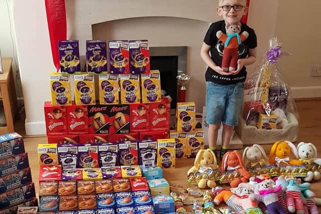 George with some of the eggs, treats and gifts he collected for children spending Easter at the Royal Blackburn Hospital.