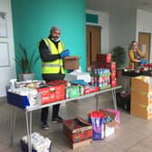 Packing boxes are Rashid Hussain, Project Manager at Inspiring Grace, and Laura Jackson, Pendle Leisure Trust's Events Coordinator.