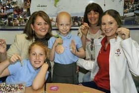 Tia (centre) with (from left to right) her sister Tegan, St John's headteacher Mrs Kathleen McKeating, Olympian Sophie Hitchon and Wendy Hitchon making a Jet Set Angel during Sophie's visit to the school in 2016 (photo by Kelvin Stuttard)