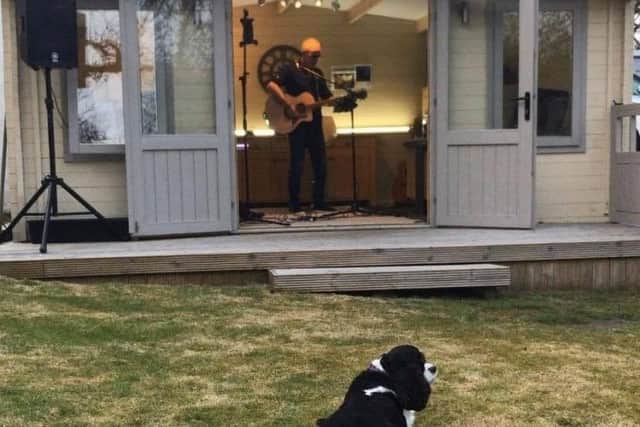 Andy Bannister performing in his garden