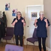 Staff at Complete Care Services give their visors the thumbs up
