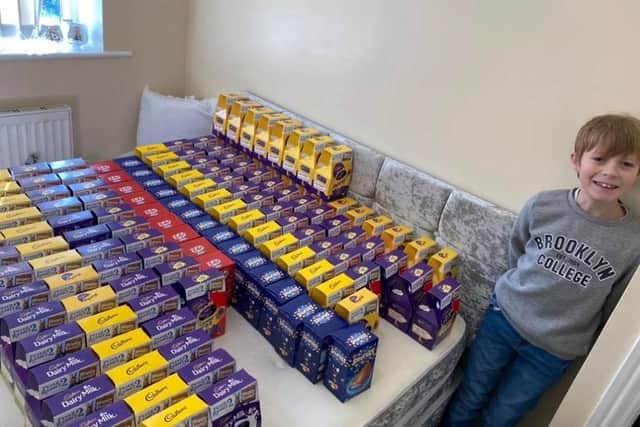 Jayden with the Easter eggs he bought with the money donated to him