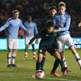 Kane Paterson of Burnley on the ball with Cole Palmer of Manchester City during the FA Youth Cup match between Manchester City and Burnley at The Academy Stadium on March 4th