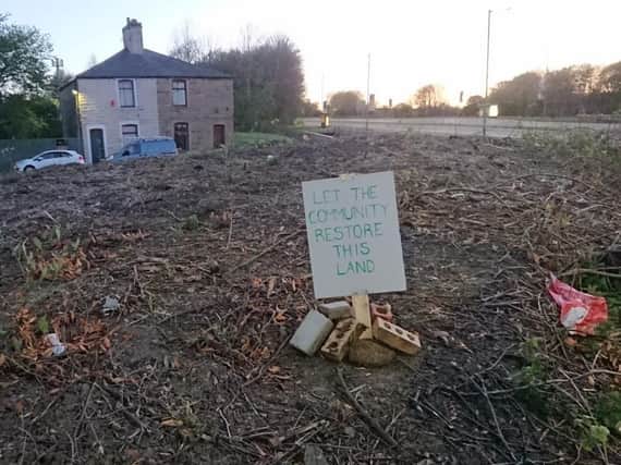 This poignant sign saying "Let the community restore this land' was placed by residents living close to The Copse in Burnley this week. The land was sold at auction by the county council for 48,000 yesterday.