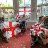 Residents fly the flag for England during lockdown