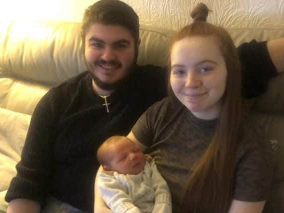 Mia Flynn and Josh Astin with their son Max who is nine weeks old.