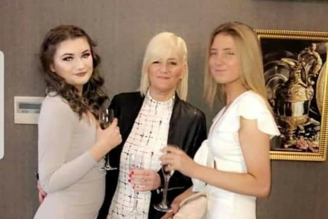 Tracey Ashworth, a carer whose vehicle was destroyed in an arson attack, with two of her children, Chloe Simpson (left) and Elle Knowles.