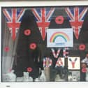 One of the windows bedecked in Fence for VE Day 75th anniversary