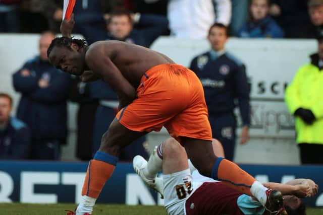 Andre Bikey of Reading rips off his shirt after being given a red card during the Coca-Cola Championship Play-off Semi Final First Leg match between Burnley and Reading at Turf Moor on May 9, 2009 in Burnley, England. (Photo by Christopher Furlong/Getty Images)
