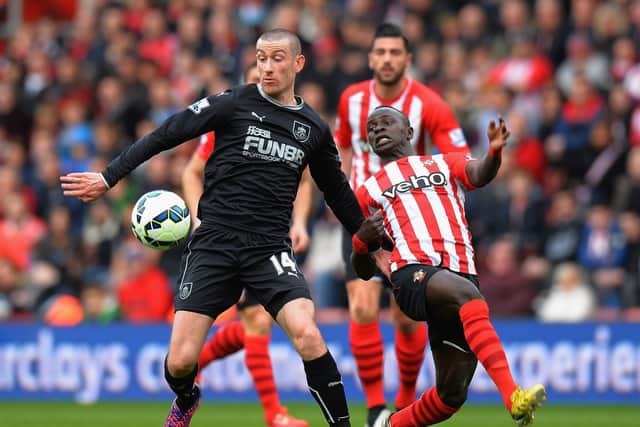 Sadio Mane challenges David Jones during the Barclays Premier League match between Southampton and Burnley at St Mary's Stadium on March 21, 2015. (Photo by Tony Marshall/Getty Images)