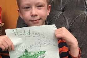 Arthur proudly shows off his drawing of the shield bug he found which earned him a certificate from Association for Science Educations GreatBugHunt2020