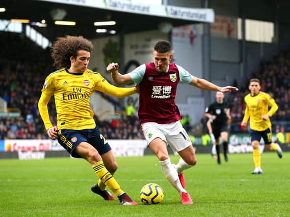 Matteo Guendouzi of Arsenal tackles Ashley Westwood of Burnley during the Premier League match between Burnley FC and Arsenal FC at Turf Moor on February 02, 2020. (Photo by Alex Livesey/Getty Images)