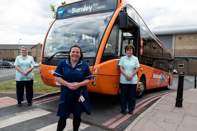From left, health care assistant Christina Walls, midwife Rachel Magee-Thorpe and maternity support worker Diane Townsend at Burnley General Teaching Hospital with The Burnley Bus Companys Burnley Heroes bus.