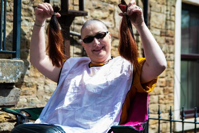 Martine sports her new look after the 'brave the shave'
