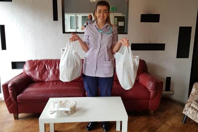 A Pendleside Hospice workers picks up some free food from Bombay Lounge