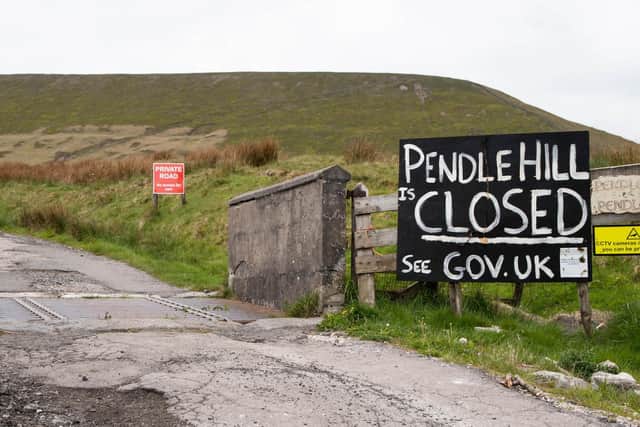 Pendle Hill signs urging walkers to stay away