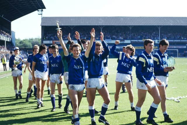 Everton players including Alan Harper (left with trophy), Adrian Heath (centre with trophy top), Neil Pointon (3rd right), Kevin Sheedy (2nd right) and Wayne Clark (holding award right) parade the Division One League Championship trophy following their First Division match against Luton Town at Goodison Park on 9th May 1987. (Photo by Simon Bruty/Allsport/Getty Images/Hulton Archive)