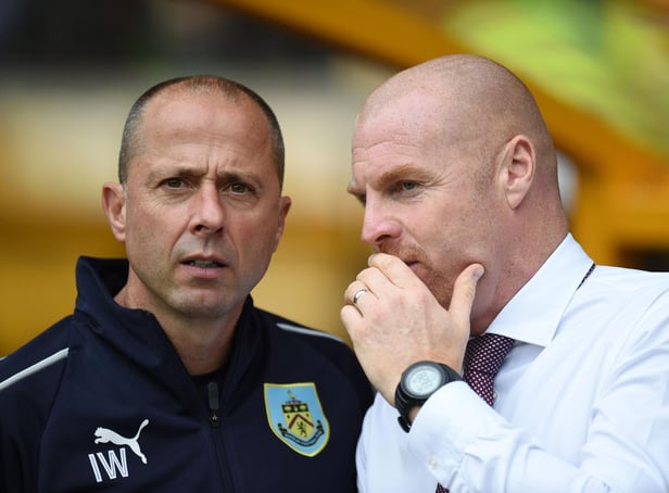 Burnley's manager Sean Dyche (R) chats with his assistant Ian Woan ahead of the English Premier League football match between Wolverhampton Wanderers and Burnley at the Molineux stadium in Wolverhampton on September 16, 2018. (Photo by Oli SCARFF/AFP)