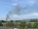 Smoke could be seen pouring from the site of the blaze in Edisford Road, Great Mitton yesterday. (picture courtesy of Ben Kenyon)