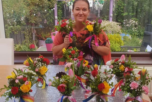 Burnley florist Kathryn Beaver with some of the Rainbow jars of joy.