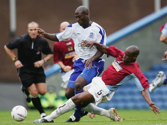 Frank Sinclair challenges Kevin Campbell