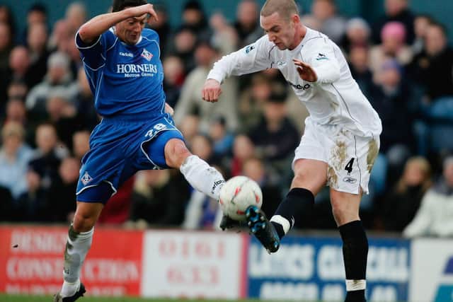 David Eyres of Oldham tussles with Kevin Nolan of Bolton during the FA Cup fourth round tie between Oldham Athletic and Bolton Wanderers at Boundary Park, on January 30, 2005 in Oldham, England. (Photo by Ross Kinnaird/Getty Images)
