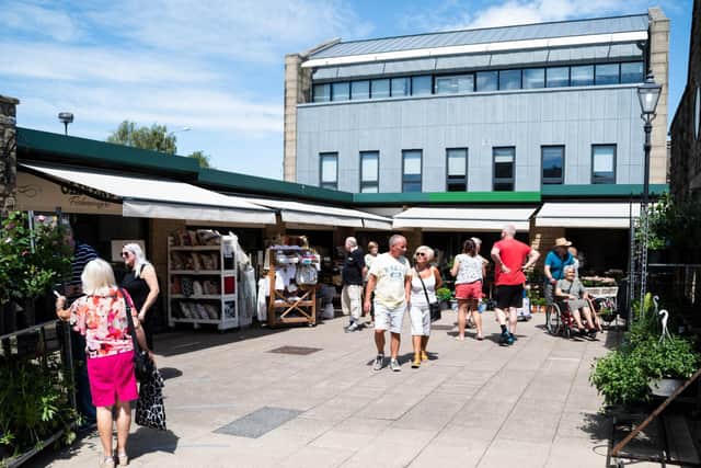 Customers flock to the market in glorious sunshine
