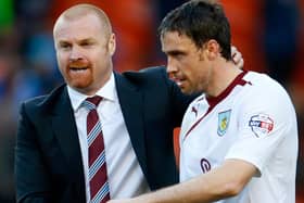 Manager Sean Dyche (L) of Burnley congratulates player Michael Duff at full time of the Sky Bet Championship match between Blackpool and Burnley at Bloomfield Road on April 18, 2014 in Blackpool, England. (Photo by Paul Thomas/Getty Images)