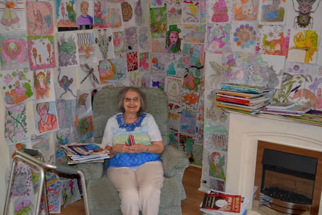 Jacqueline Floyd at home with her colouring